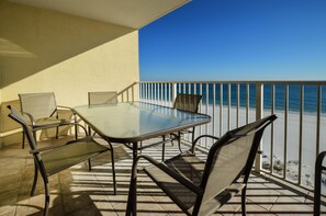 Balcony of Unit 7C - The large balcony features a table with seating for 6