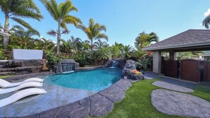 Private pool with waterfalls surrounded by lush tropical landscaping