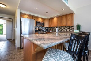 Kitchen With Granite Counters And Stainless Steel Appliances