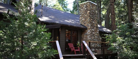 Front of cabin with welcoming porch. - Front of cabin with welcoming porch.