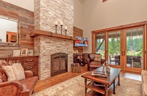 Three Sisters Lodge - Ledgestone Gas Fireplace and a large Flatscreen with Cable and Blue-Ray player.