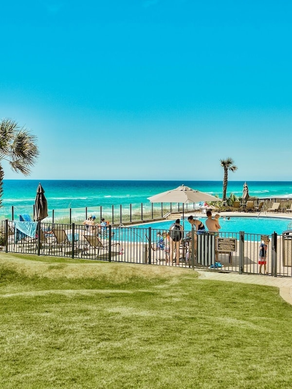 Gulf front pool - Adagio A105's view from its patio to the gulf front pool, heated in the cooler months.