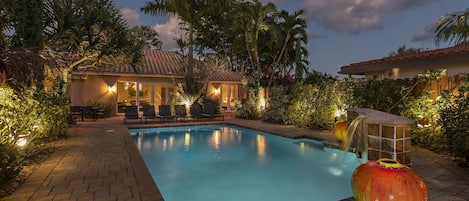 A very private fenced in romantically lit up backyard