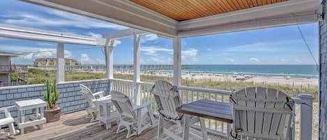 The spacious porch offers stunning views of the sunset
