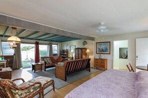 View from dining area back toward bedrooms, 3rd queen bed in foreground