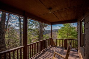 Huge covered deck with rocking chairs and beautiful views...