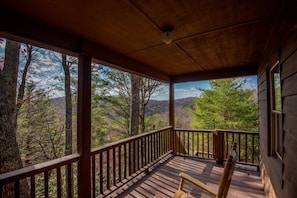 Huge covered deck with rocking chairs and beautiful views...