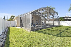 Spacious, fully fenced in back yard for your four legged friend