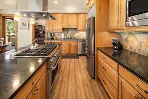 Pine Cone: - Fully stocked kitchen with a gas cooktop and granite counters.