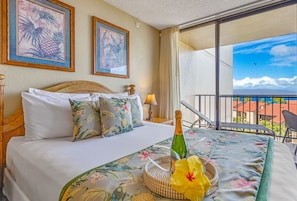 king bed studio with stunning ocean and mountain views
