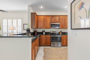 The kitchen features luxurious granite throughout as well as 42" cabinetry.
