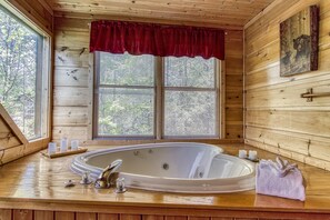 sit and relax inside this heart shaped jacuzzi tub and still be able to enjoy the views