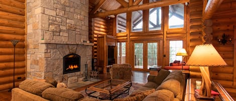 Great Room w/ Wood-Burning Fireplace, Plenty of Seating, & Lake Views