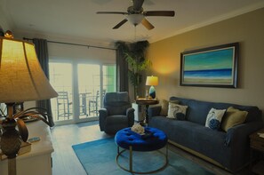 Living area with beach and ocean view from balcony!