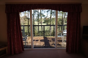 Step out through the patio doors onto your balcony with views of the countryside