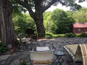 Bluestone Patio with garden shaded by a canape of trees- only 1/2 of patio shown