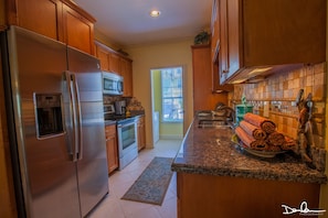 Full size kitchen appliances with dish washer and full-size washer and dryer 