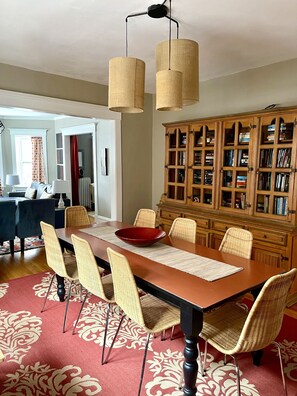 Spacious dining room that seats 10 with desk and library.