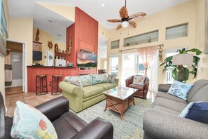 Living area with plenty of seating and large screen streaming TV