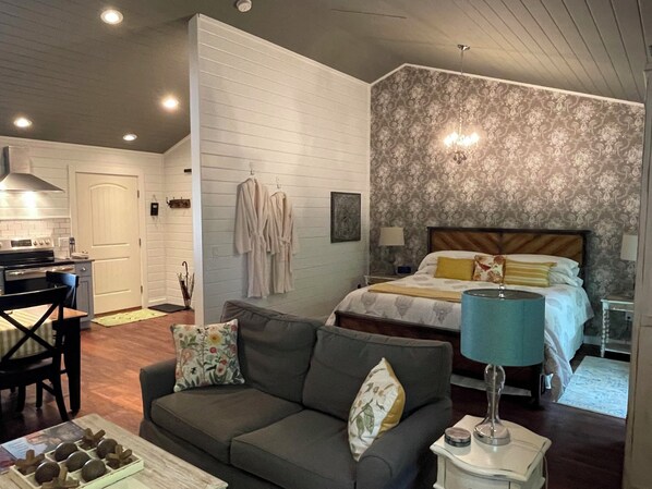 Comfortable king-size bed in an open-concept cozy cabin.