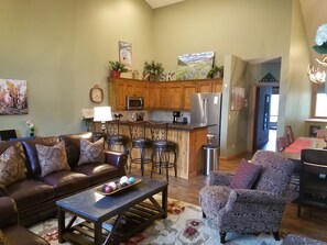 Open living room with vaulted ceiling and plenty of space to stretch out