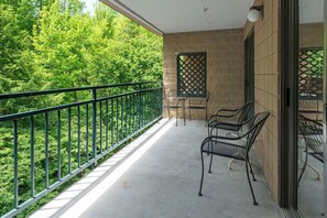Large private balcony overlooking the river.