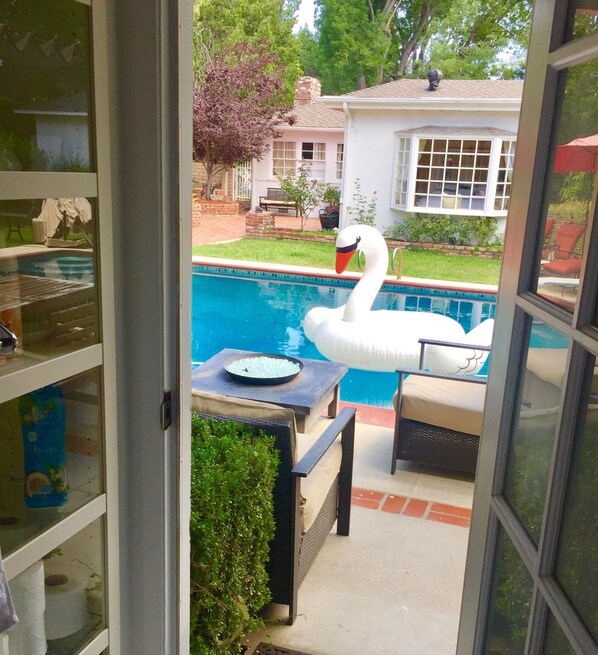 Looking out to Pool through Bathroom door.  