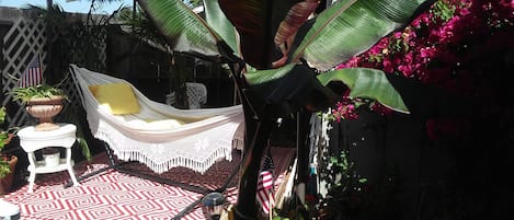 Brazilian hammock in the shade.  Umbrella lights up at night.  