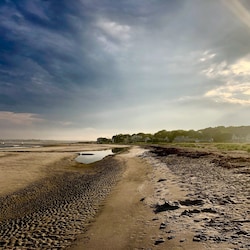 Low tide creating beautiful beach strolls