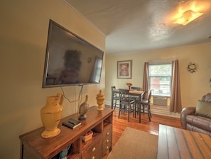 Spacious Dining room / Living room with a couch, recliner, and 50" TV