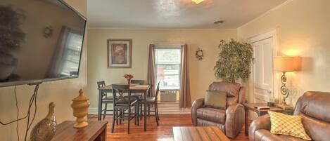 Spacious Dining room / Living room with a couch, recliner, and 50" TV