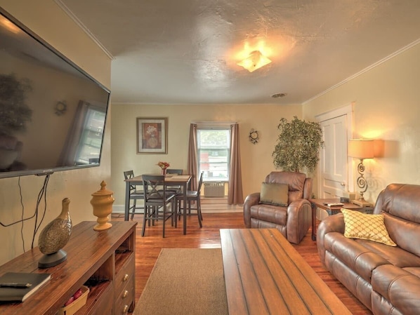 Spacious Dining room / Living room with a couch, recliner, and 50" TV