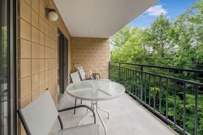 Large private balcony overlooking the river.