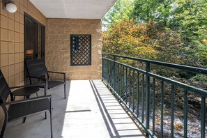 Large private balcony overlooking the river.