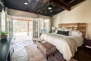 Master bedroom with french doors to the courtyard