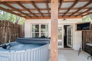 Private hot tub with an outdoor TV