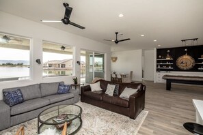 large windows in main open floor living space, water and Mountain View’s
