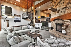 Cozy up to the fire in the open great room with flat screen and pool table.