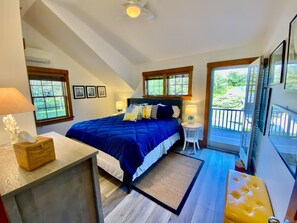 Spacious master bedroom with a king bed and private doorway to the deck.