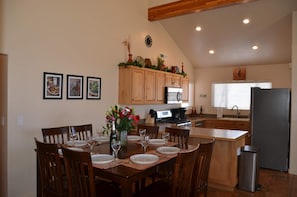 Dining for up to 8. Leaf is inside the table. Split the table in half and open.