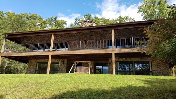 Front of house facing the mtns. Note the reflection in the door!