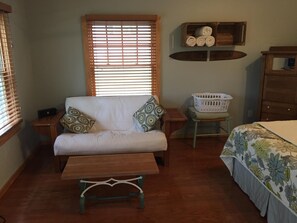 Futon converts to full-sized bed.