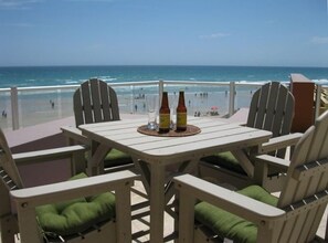 Relax at the high top table overlooking the beach.