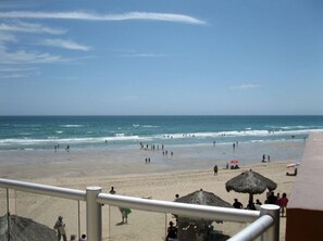 View of beach off of the edge of our patio.