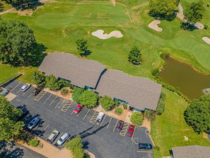View of this Condo's building from above, Golf Course directly behind it. 