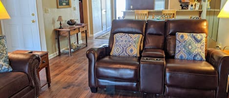 Bright & Clean Living Room has electric fireplace and views of the lake. 