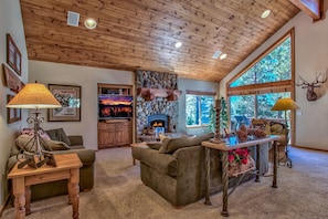 Living Area part of Great Room with wood burning fireplace, big TV, sound system