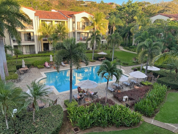 Activity pool as viewed from condo balcony. Lounges, tables+umbrellas provided