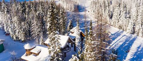 The three snowy Snow Bear Chalets, directly ON Hope Slope at Whitefish Mountain Resort. Come ski with us!