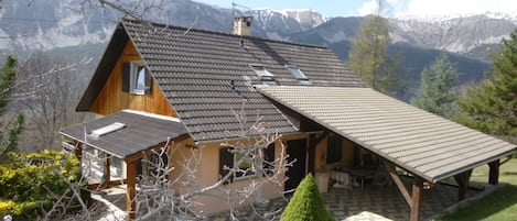 La Pommière in early spring with the vestiges of snow on the mountain tops